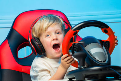 Portrait of young woman in car