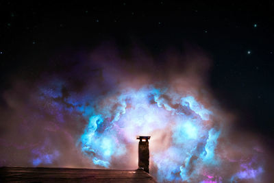 Light painting against sky at night