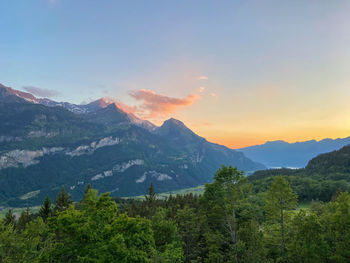 Scenic view of mountains against sky during sunset