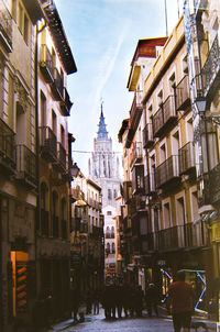 Buildings in city against sky