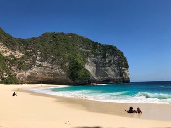 Scenic view of sea against clear blue sky