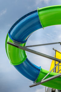 Low angle view of water slide against sky