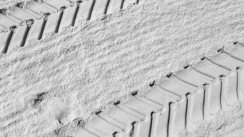 High angle view of track in sand