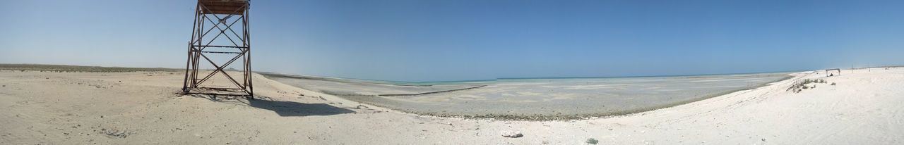 clear sky, sand, beach, copy space, tranquility, blue, tranquil scene, landscape, sunlight, desert, nature, day, scenics, non-urban scene, remote, shadow, outdoors, shore, beauty in nature, no people