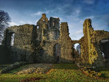 Low angle view of old building against sky