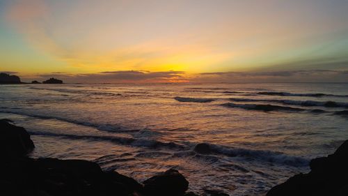 View of beach at sunset