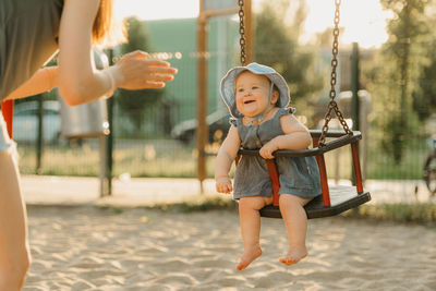 Full length of boy playing in playground