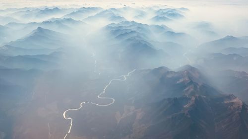 Aerial view of mountains against sky