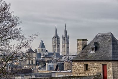 View of buildings in city against sky