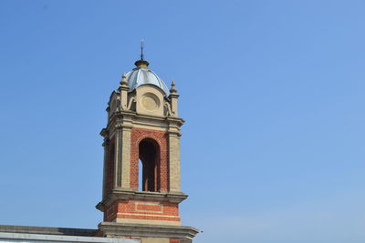 Low angle view of a building against blue sky