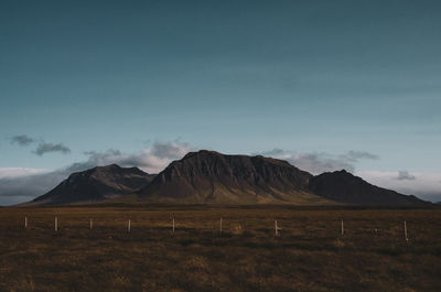 Scenic view of landscape and mountains against sky