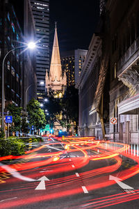 High angle view of light trails on road at night