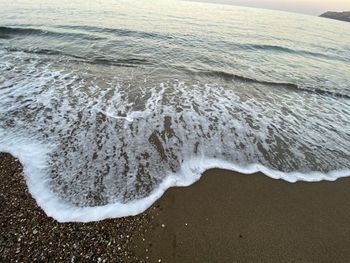 High angle view of surf on beach