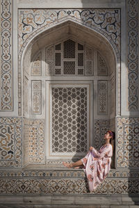 Woman in front of historical building