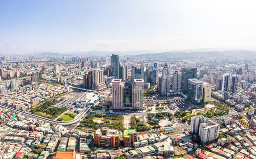 High angle view of modern buildings in city against sky