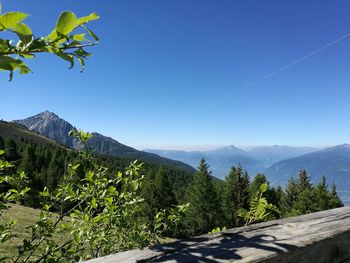 Scenic view of mountains against clear blue sky