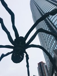 Low angle view of skyscraper against sky