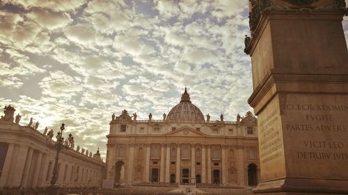 Low angle view of historical building against cloudy sky