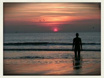 Scenic view of sea at sunset