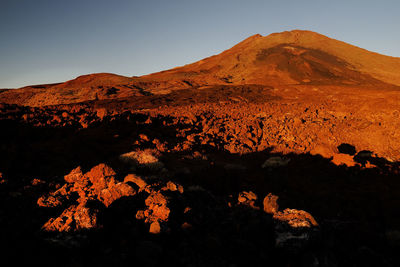 Scenic view of rocky mountains at el teide national park against clear sky