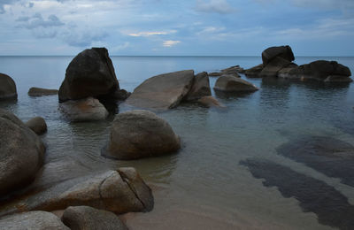 Scenic view of sea against cloudy sky