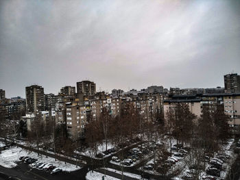 High angle view of buildings against sky during winter