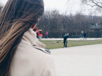 Woman standing on grassy field