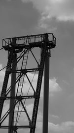 Low angle view of crane against sky