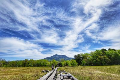 Road amidst landscape against sky