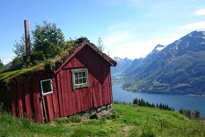 House on cliff against mountains