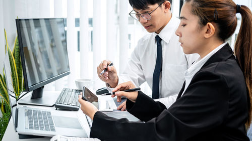 Business colleagues working at office