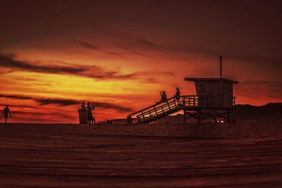 Scenic view of beach against sky during sunset