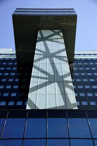 Low angle view of office building against sky