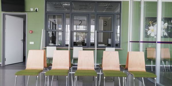 Empty chairs and tables in room