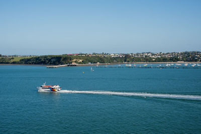 Scenic view of sea against clear blue sky