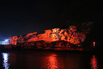 View of illuminated city against sky at night