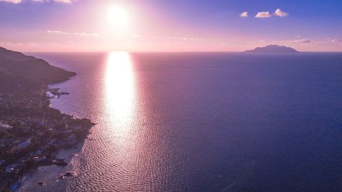 Scenic view of sea against sky at sunset