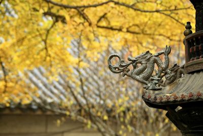 Low angle view of statue against trees