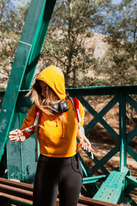 Midsection of woman holding umbrella