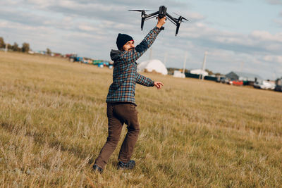 Full length of man standing on field