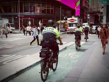 People riding bicycle on city street