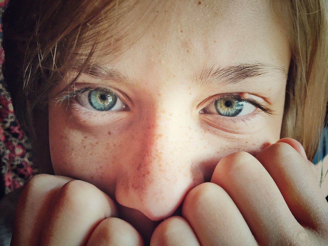 indoors, looking at camera, close-up, lifestyles, person, portrait, headshot, leisure activity, young women, human face, young adult, childhood, front view, innocence, part of, relaxation