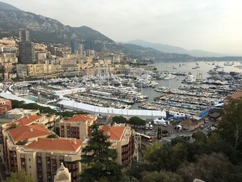 High angle view of townscape and sea against sky