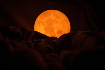 Close-up of fire against sky at night