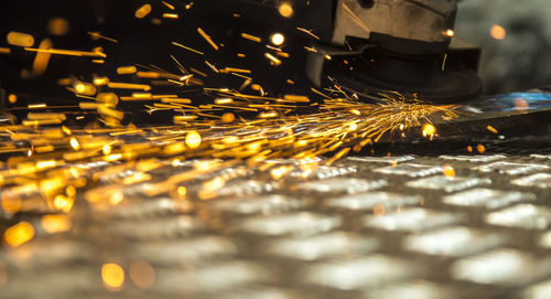 Close-up of metal being cut with handsaw