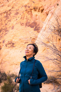 Portrait of senior asian woman in the desert landscape