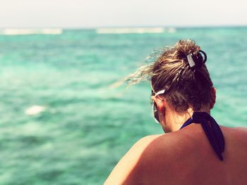 Rear view of woman looking at sea