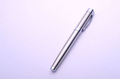 High angle view of pen on table against white background
