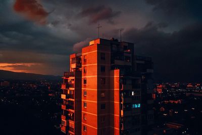 High angle view of illuminated buildings against sky at sunset