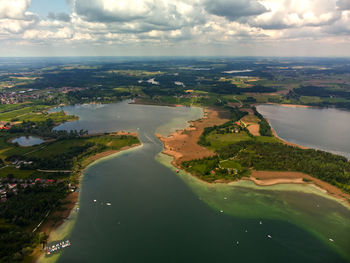 Aerial view of river amidst landscape against sky